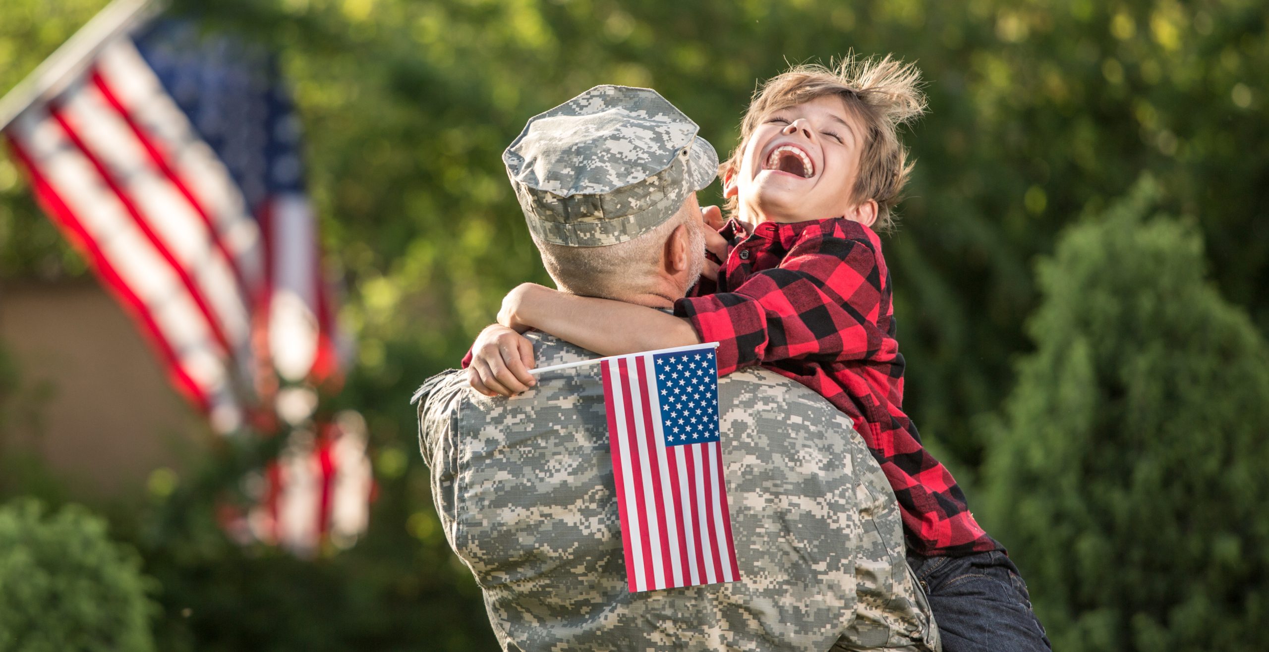 Happy reunion of soldier with family outdoors